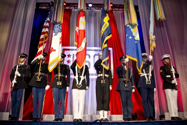 Military color guard presenting the flags of the U.S. armed forces